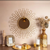 Artistic sunburst-style mirror in antique golden finish