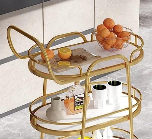 Close-up of White Marble Top on Golden Oval Trolley