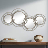 Modern wireframe wall mirror with overlapping circular metal rings in pewter finish"
