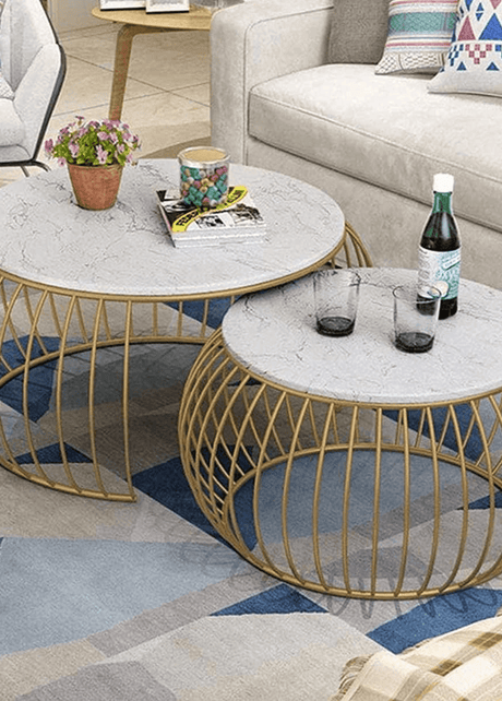 Modern metallic coffee table with sleek metal legs and a smooth wooden tabletop, perfect for adding a contemporary touch to any living space