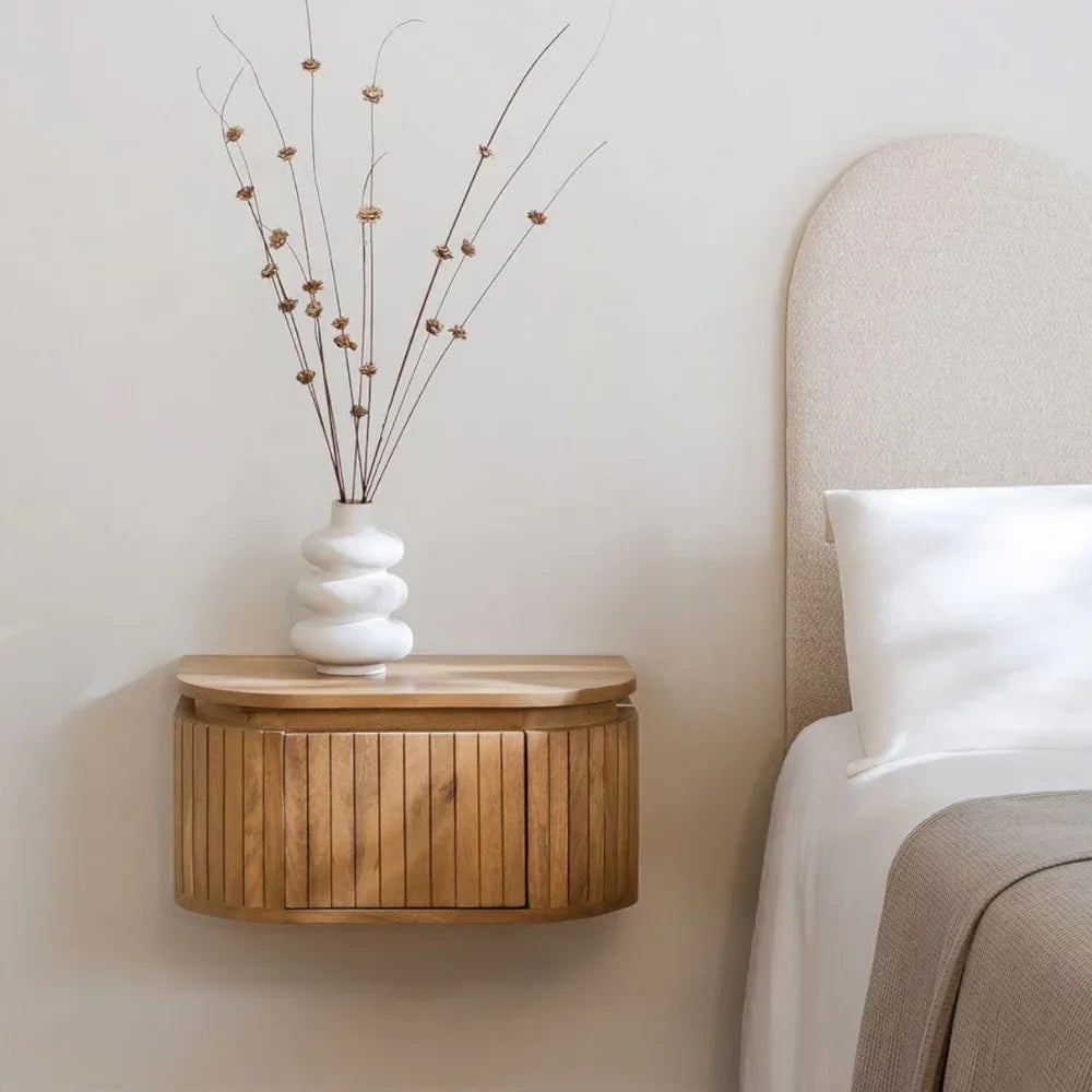 A wall-mounted nightstand that frees floor space