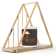 Triangle golden wall shelf styled in a living room