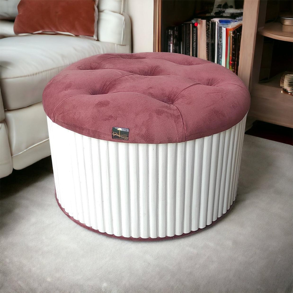 A handmade tufted pouffe ottoman