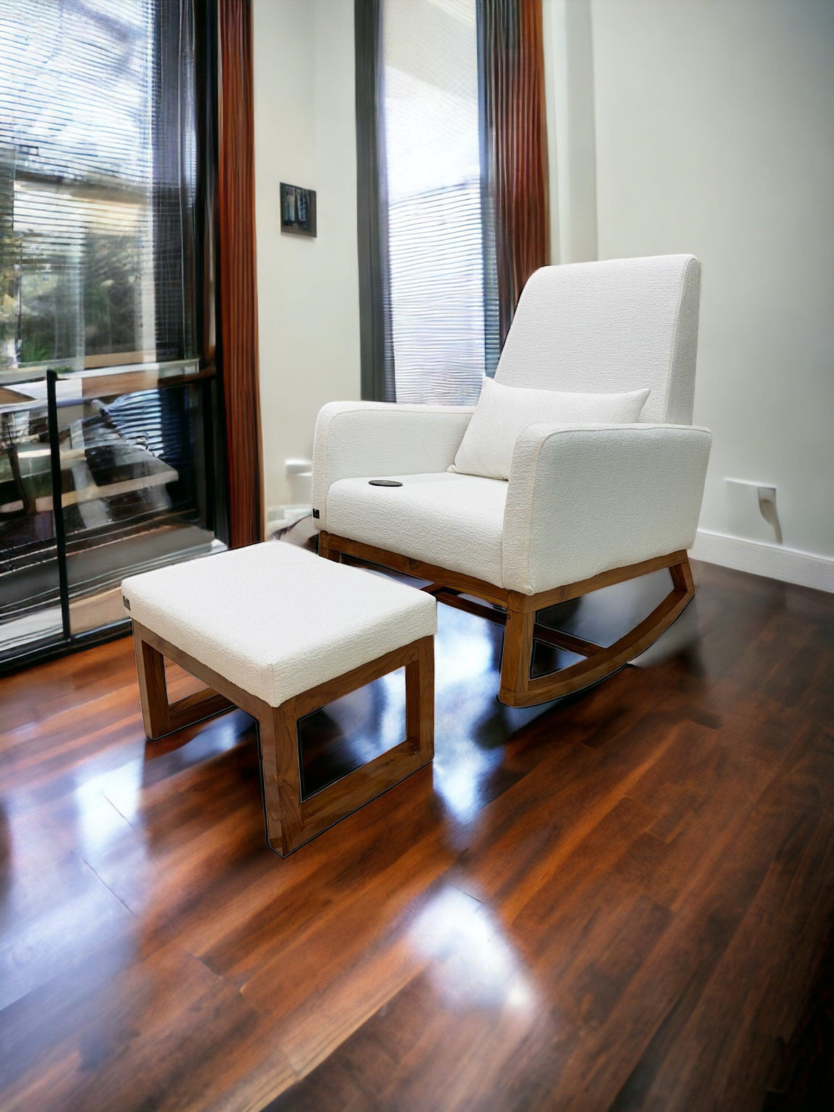 A boucle rocking chair with matching ottoman