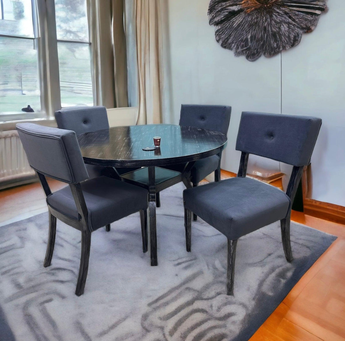 A tufted 4 seater round dining set