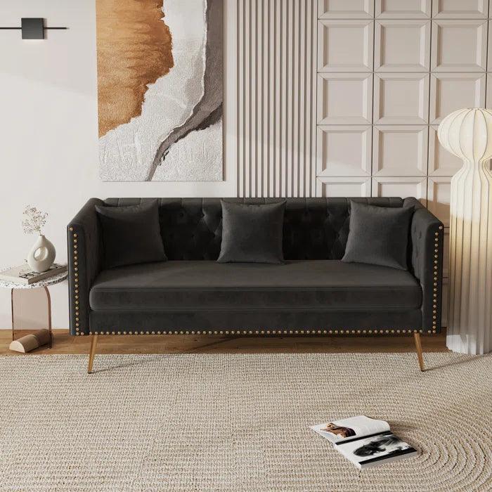 A velvet 3 seater with gold-finish legs