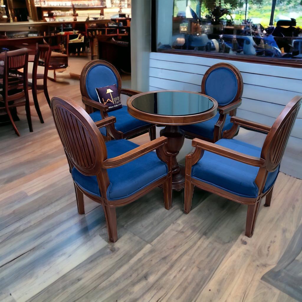 A round teak dining set for four