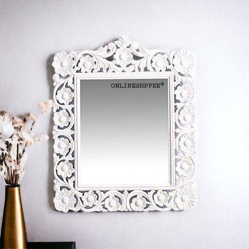 A white carved frame that brightens any wall