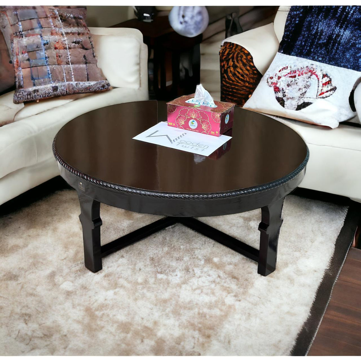 A handmade teak round coffee table