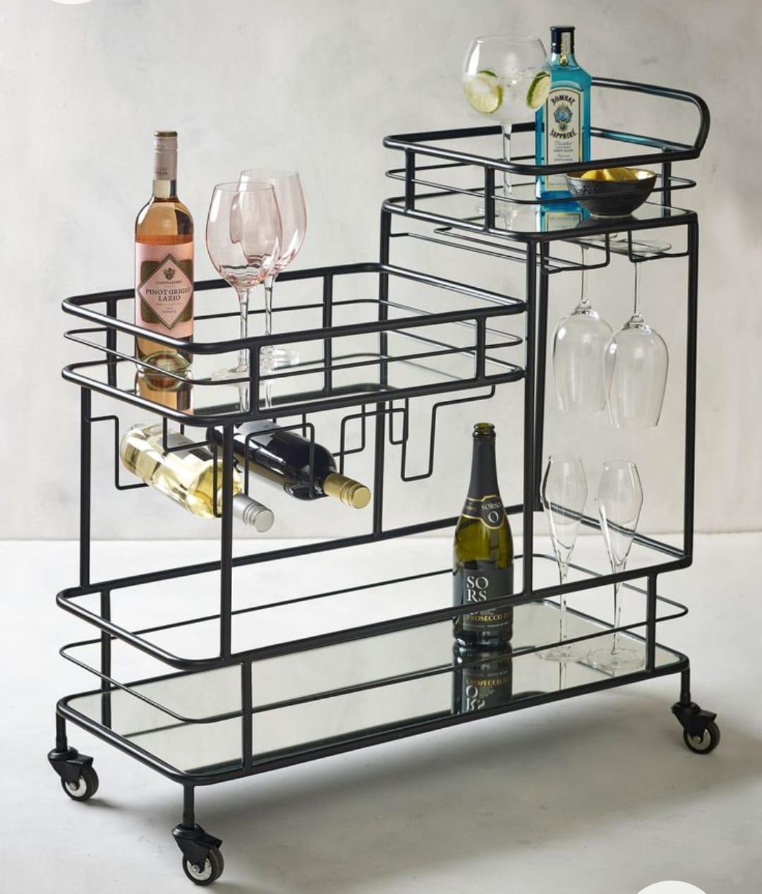 A black iron trolley with a mirror top