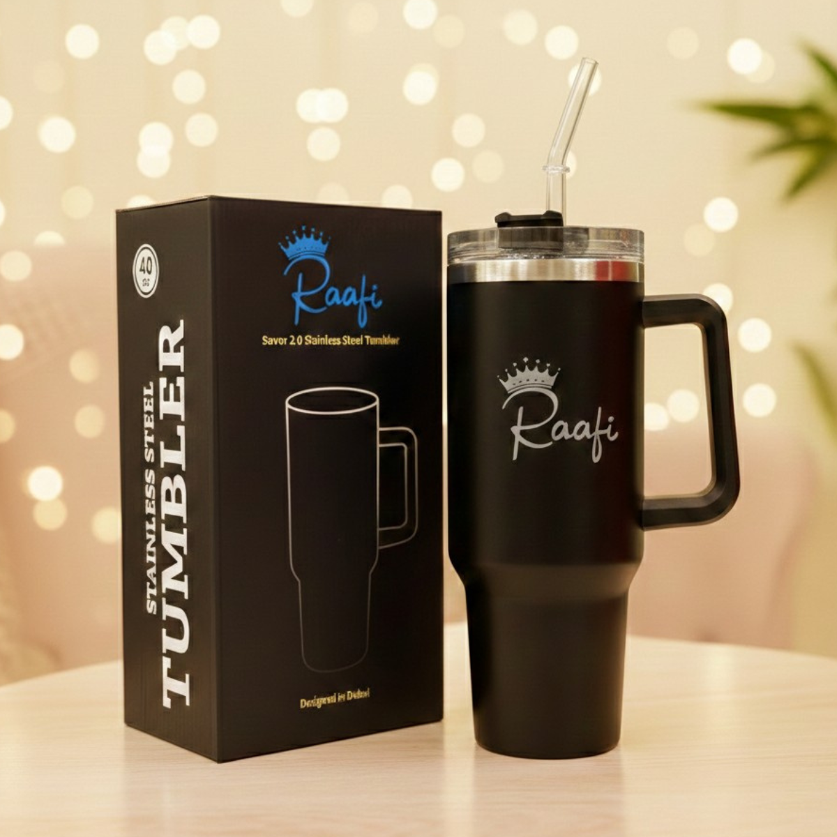 a 40oz Raafi insulated stainless steel travel tumbler in a matte peach-pink finish inside a car. The image features a clear lid with a reusable straw and the Raafi brand logo, set against a cinematic night background with blurred city street lights.