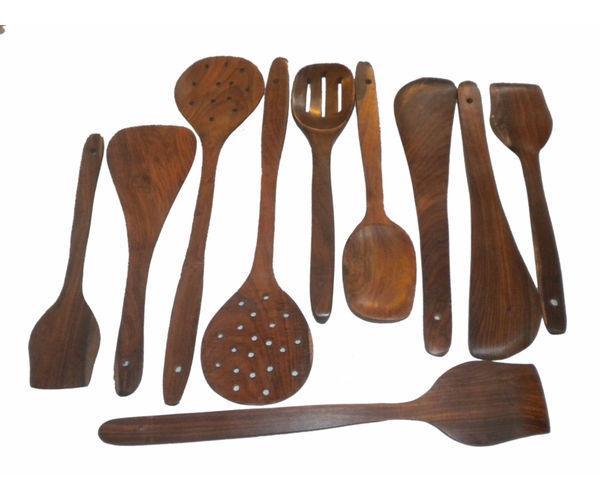 Handcrafted wooden cutlery set laid out on a surface