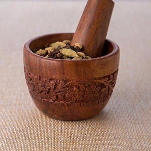 Wood carved pestle and mortar for grinding kitchen spices
