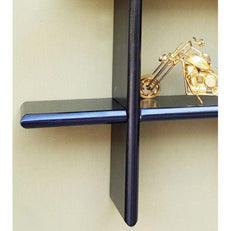 Criss Cross Floating Wall Shelf holding books and decor