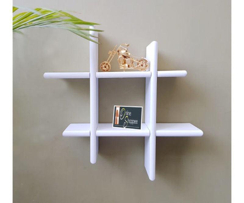 Criss Cross Floating Wall Shelf holding photo frames