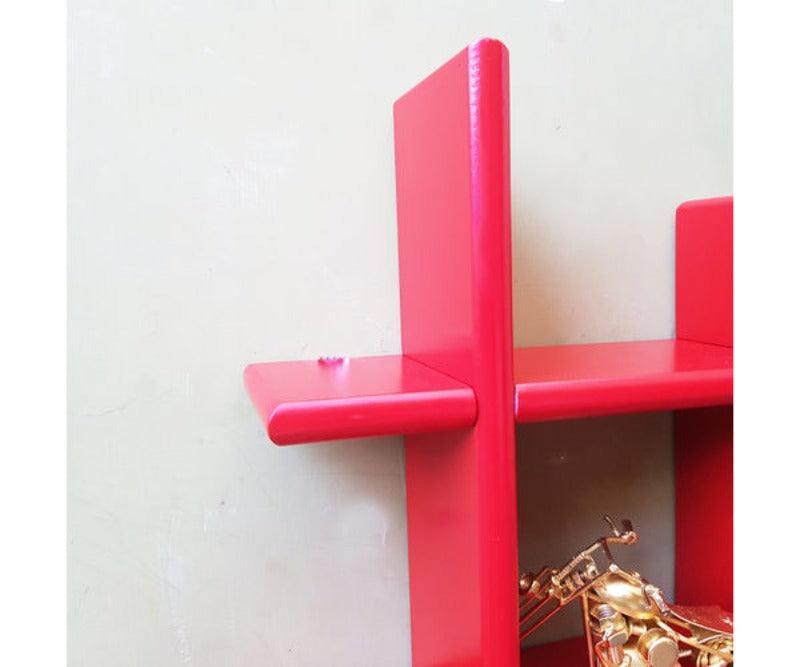 Criss Cross Floating Wall Shelf wall mounted above a sofa