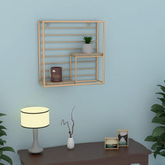 Square Metallic Twist Wooden Wall Shelf in Golden mounted on a wall