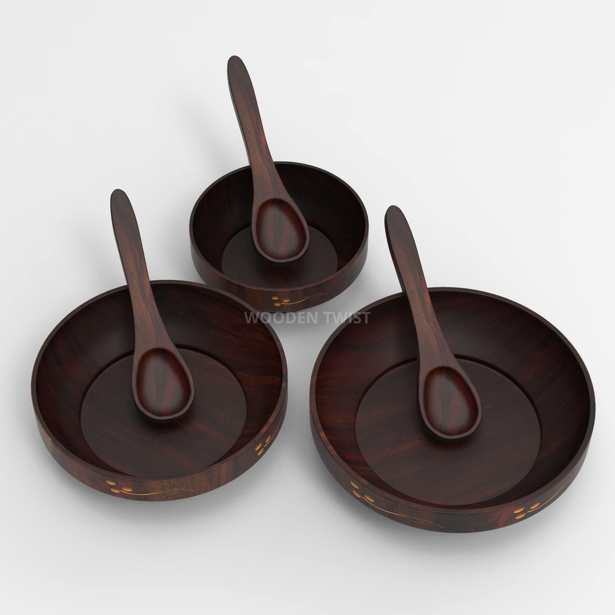 Brown polished Sheesham wood bowls stacked together