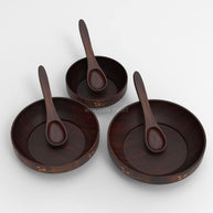 Brown polished Sheesham wood bowls stacked together